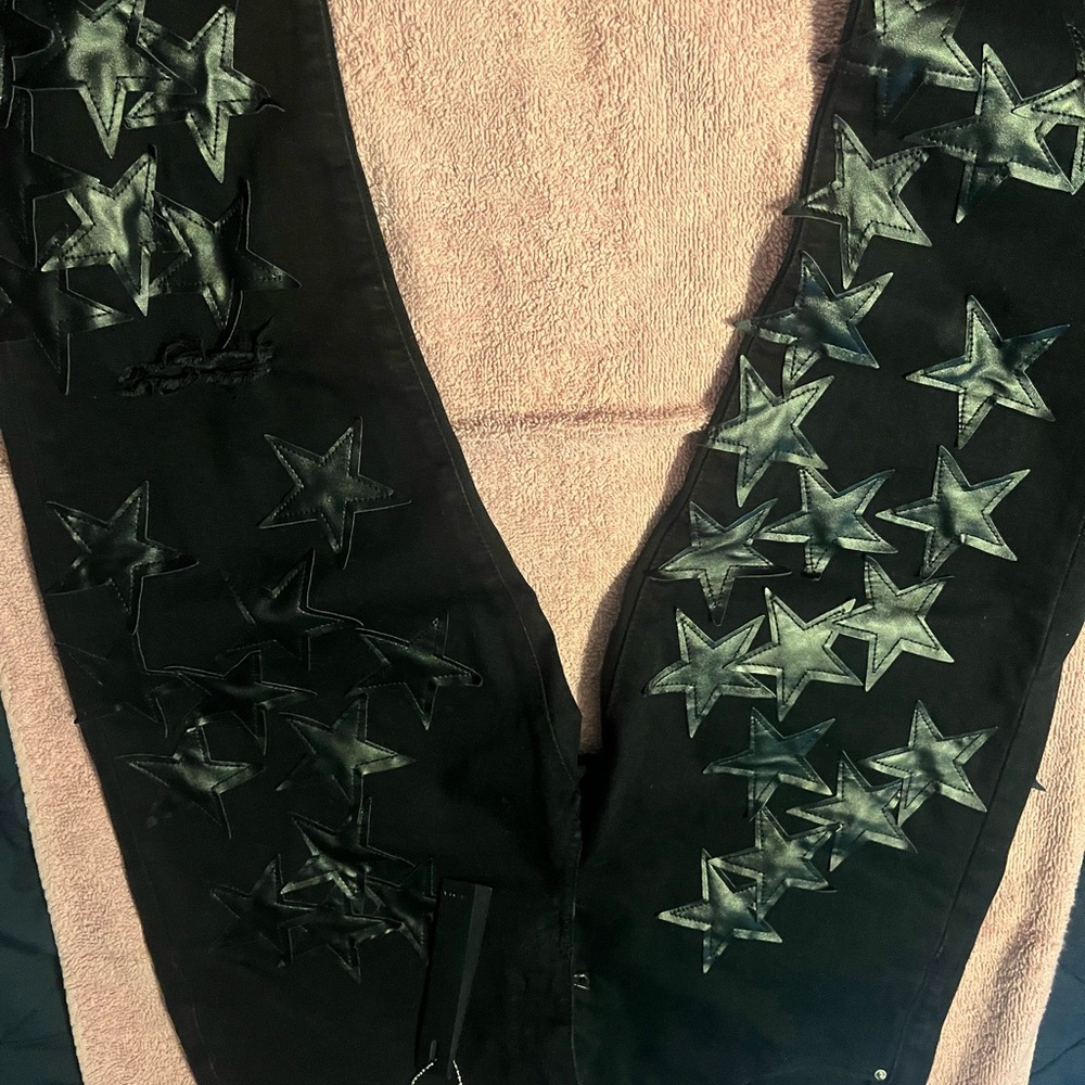 Black Amiri Jeans with stars